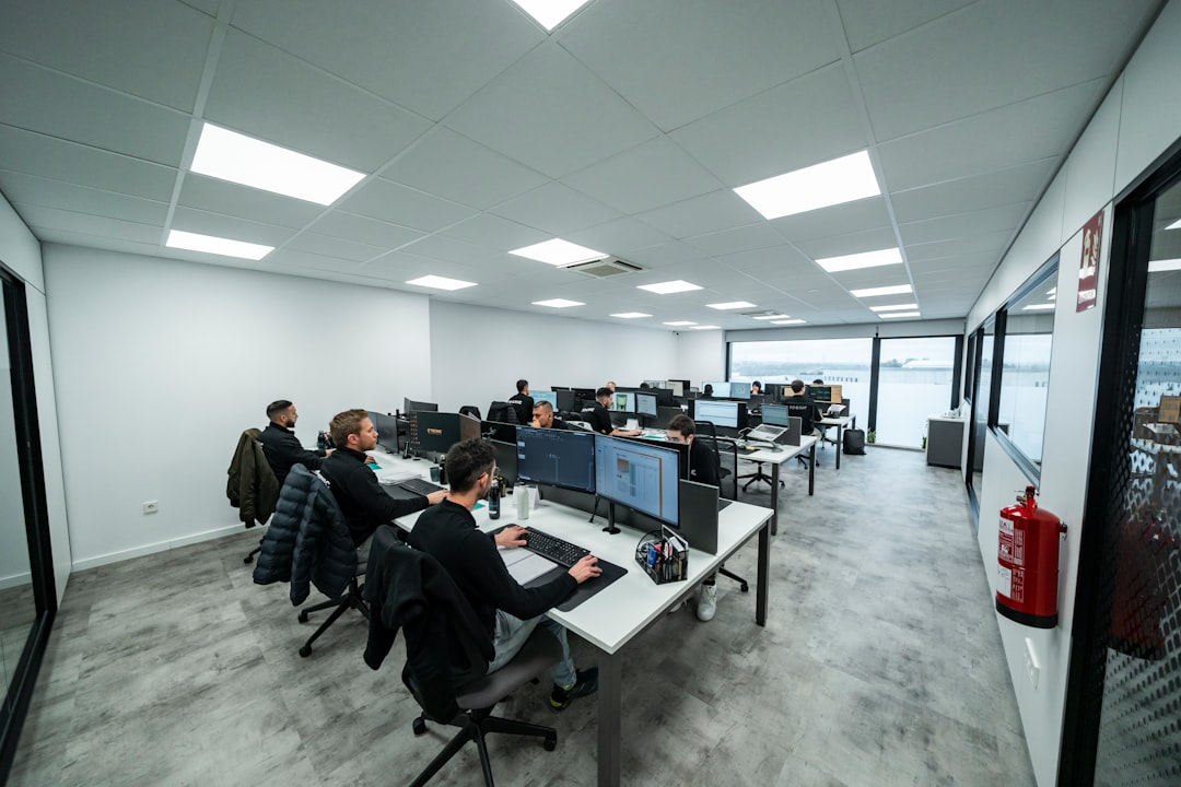 Technology research workspace with professionals using computers